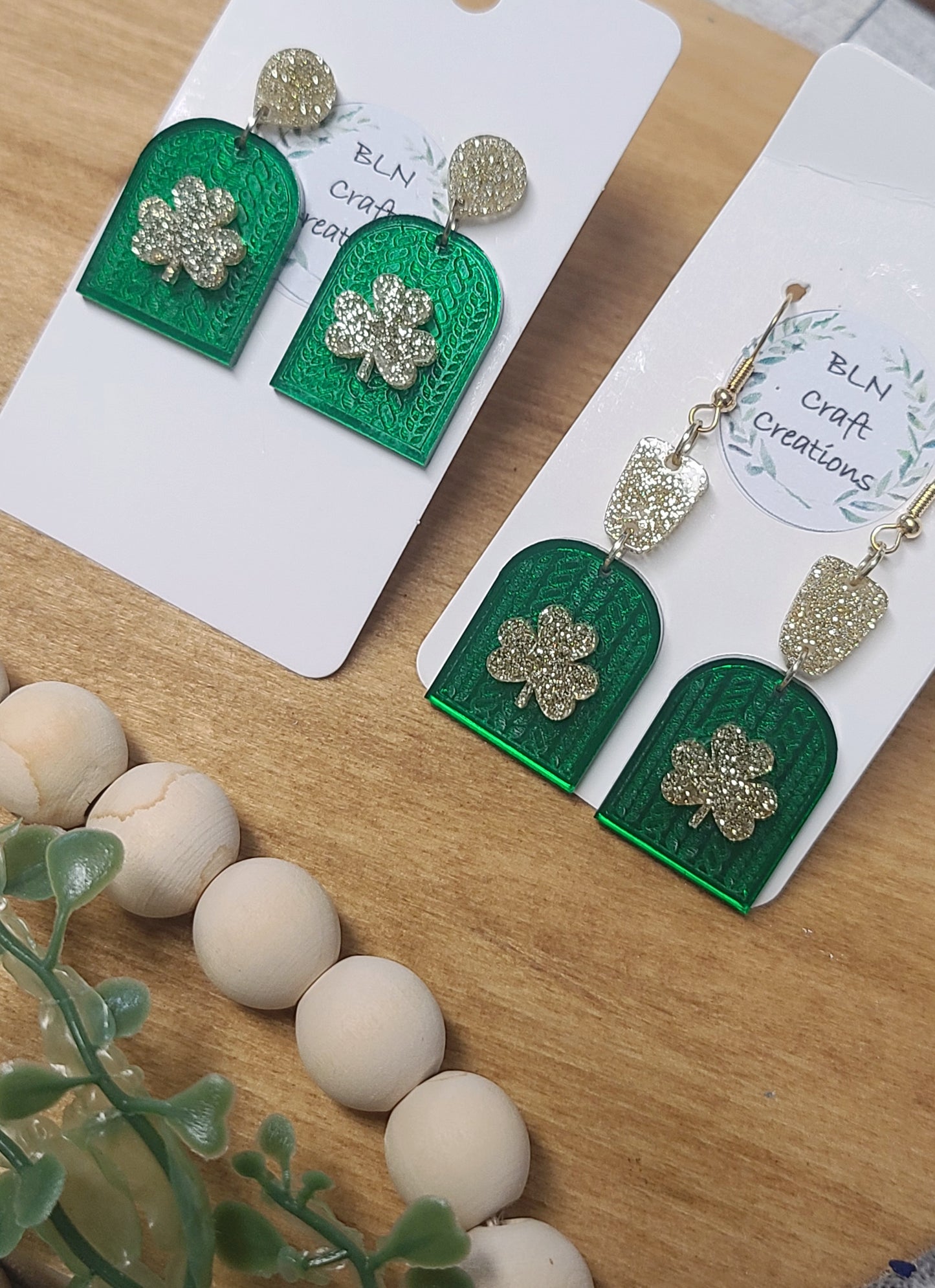 Braided arch clover acrylic earrings