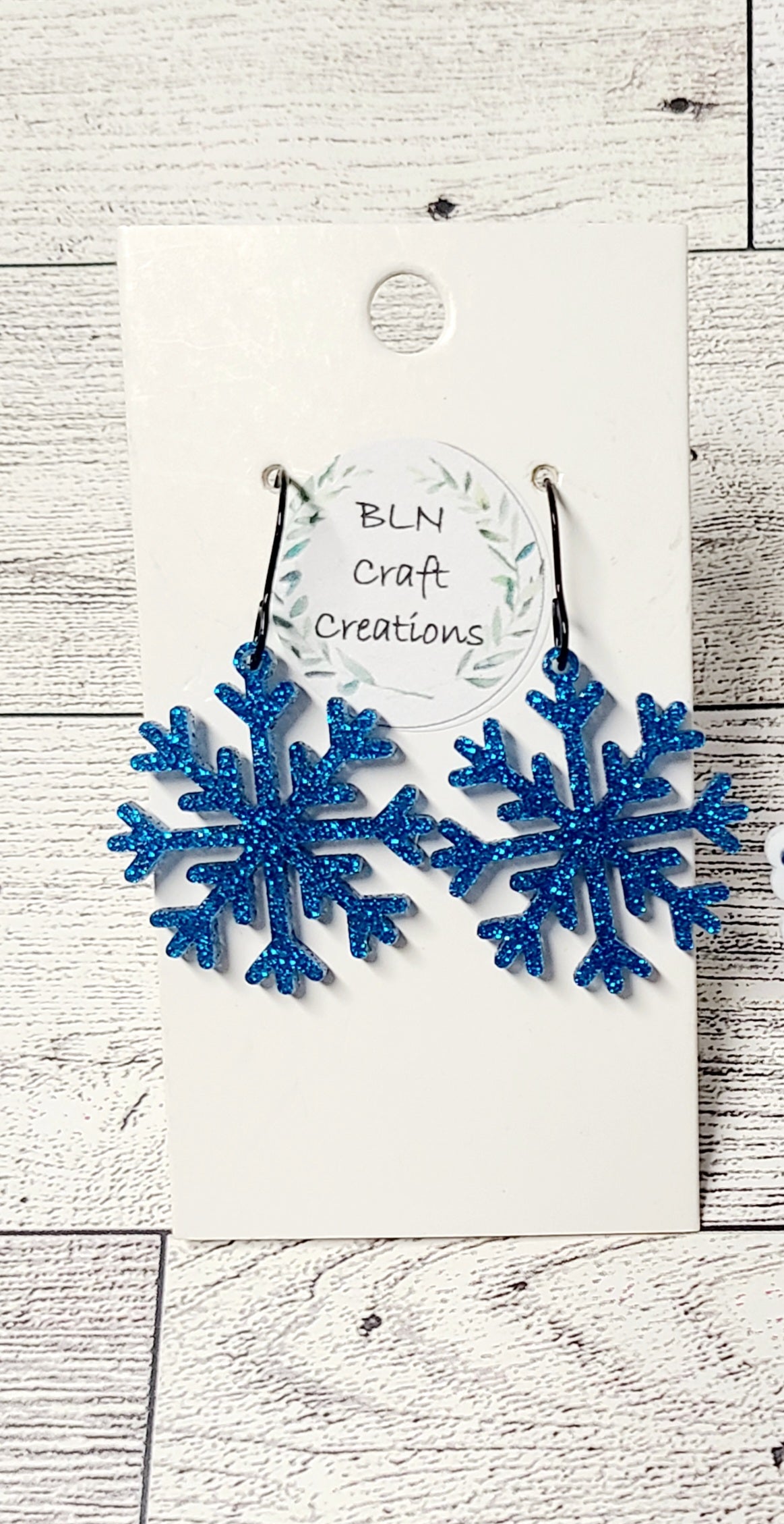 Blue glitter snowflakes earrings